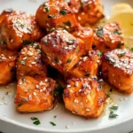 Air Fryer Salmon Bites with honey garlic glaze or lemon pepper seasoning crispy outside tender inside served over rice with broccoli